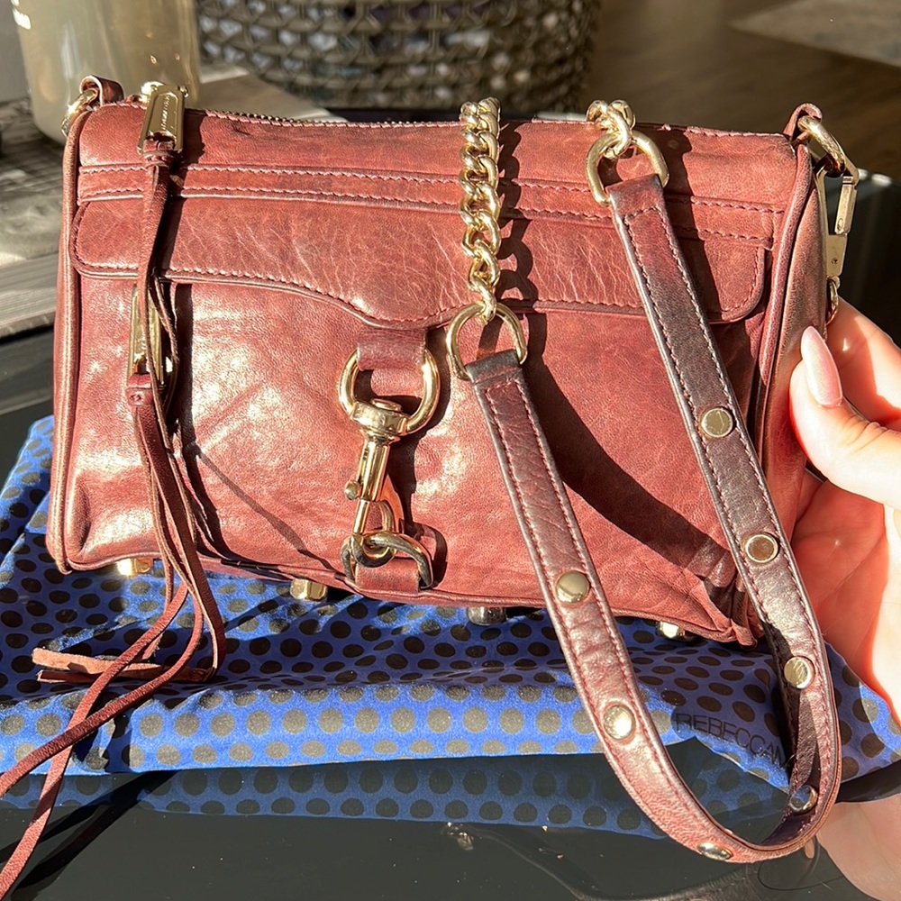Rebecca mink off cross body bag. Plum color